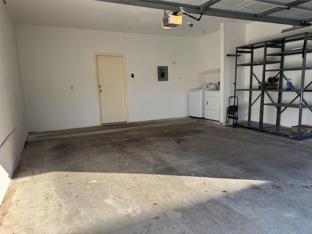 9850 Pagewood Ln Unit 1001, Houston, TX 77042 - garage with electric panel, separate washer and dryer, and a garage door opener