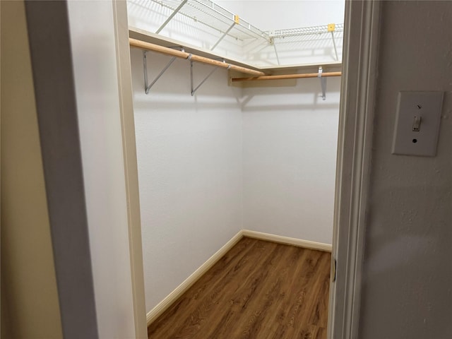 9850 Pagewood Ln Unit 1001, Houston, TX 77042 - walk in closet with wood finished floors