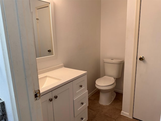 9850 Pagewood Ln Unit 1001, Houston, TX 77042 - bathroom featuring tile patterned flooring, toilet, vanity, and baseboards