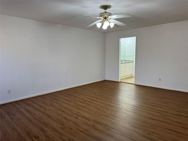9850 Pagewood Ln Unit 1001, Houston, TX 77042 - unfurnished room with a ceiling fan, wood finished floors, and baseboards