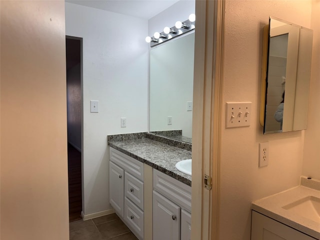 9850 Pagewood Ln Unit 1001, Houston, TX 77042 - bathroom with two vanities and tile patterned floors