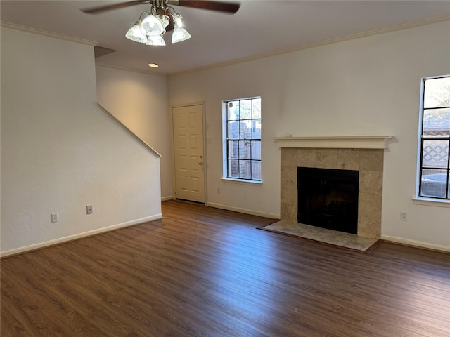 9850 Pagewood Ln Unit 1001, Houston, TX 77042 - unfurnished living room with ceiling fan, ornamental molding, plenty of natural light, wood finished floors, and baseboards