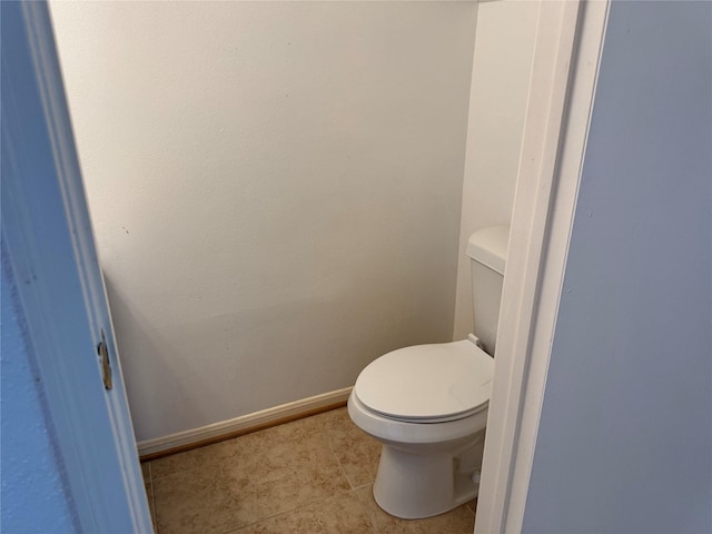 9850 Pagewood Ln Unit 1001, Houston, TX 77042 - bathroom with toilet, tile patterned flooring, and baseboards