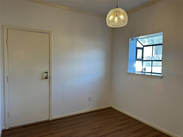 9850 Pagewood Ln Unit 1001, Houston, TX 77042 - empty room with a chandelier, ornamental molding, baseboards, and dark wood finished floors