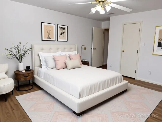 9850 Pagewood Ln Unit 1001, Houston, TX 77042 - bedroom featuring wood finished floors, ceiling fan, and baseboards
