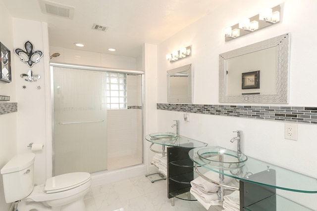 bathroom with a stall shower, marble finish floor, visible vents, and toilet