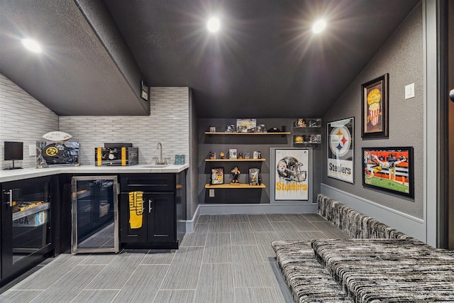 17934 Wichita River Way, Cypress, TX 77433 - bar with wet bar, a sink, beverage cooler, and vaulted ceiling