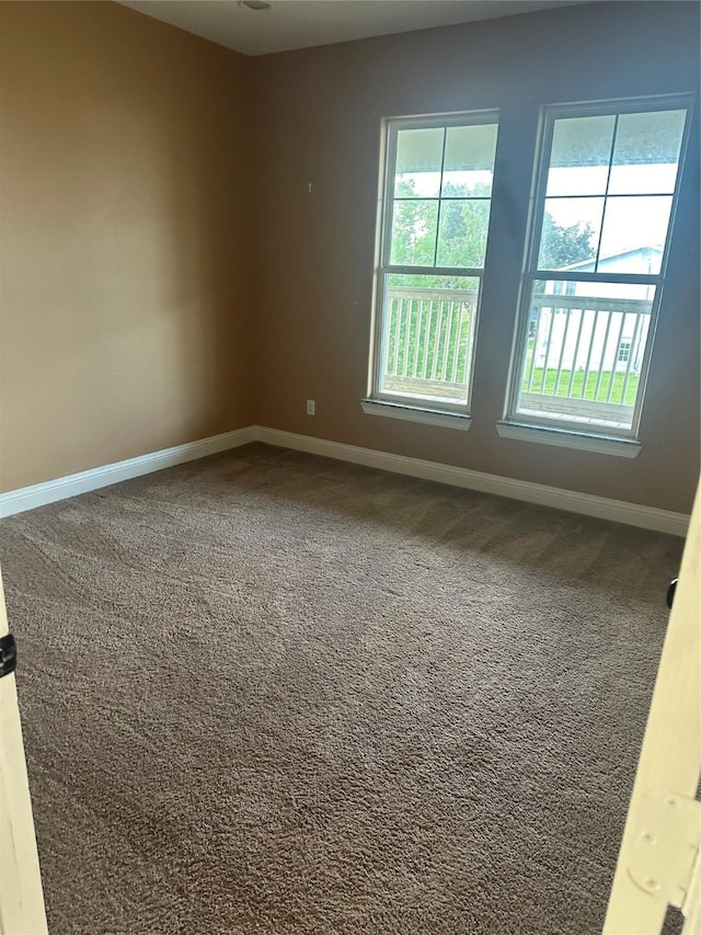 205 Rue Orleans St, Baytown, TX 77520 - unfurnished room featuring baseboards and carpet floors