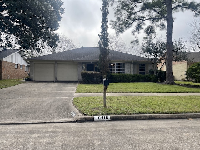 10415 Huntington Wood Dr, Houston, TX 77099 - ranch-style home featuring a garage, a front lawn, and concrete driveway