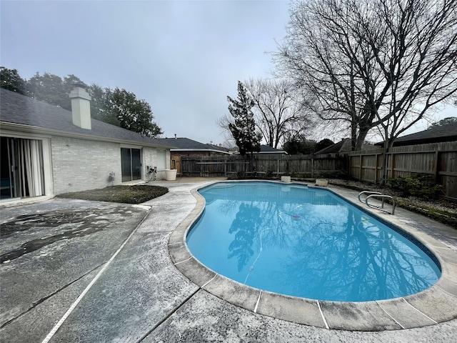 10415 Huntington Wood Dr, Houston, TX 77099 - view of pool featuring a fenced backyard, a patio area, and a fenced in pool