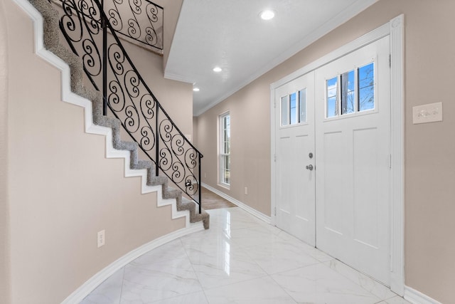 entryway with stairway, marble finish floor, baseboards, ornamental molding, and recessed lighting