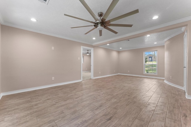 spare room featuring a ceiling fan, light wood-type flooring, baseboards, ornamental molding, and recessed lighting