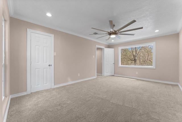 unfurnished bedroom featuring carpet flooring, crown molding, and baseboards