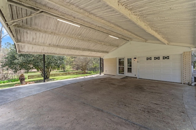 exterior space with an attached carport and a garage