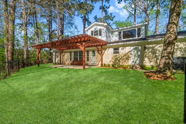 back of house with fence, a patio, brick siding, a lawn, and a pergola