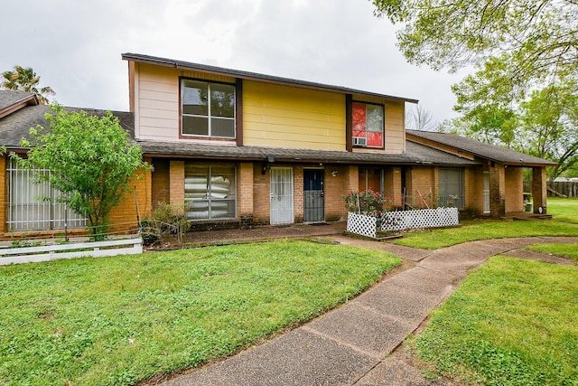 7885 Cook Rd, Houston, TX 77072 - view of front of property with a front yard and brick siding