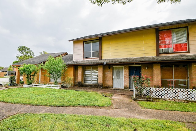 7885 Cook Rd, Houston, TX 77072 - view of front of property with a front lawn, cooling unit, and brick siding