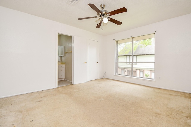 7885 Cook Rd, Houston, TX 77072 - unfurnished bedroom featuring ensuite bathroom, carpet flooring, visible vents, and a ceiling fan