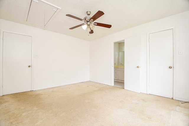 7885 Cook Rd, Houston, TX 77072 - unfurnished bedroom featuring attic access, light colored carpet, ceiling fan, and ensuite bathroom