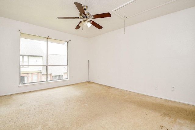 7885 Cook Rd, Houston, TX 77072 - empty room with attic access, light carpet, and a ceiling fan