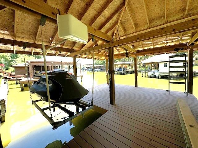 270 Lake Grove Dr, Coldspring, TX 77331 - dock featuring boat lift and a water view