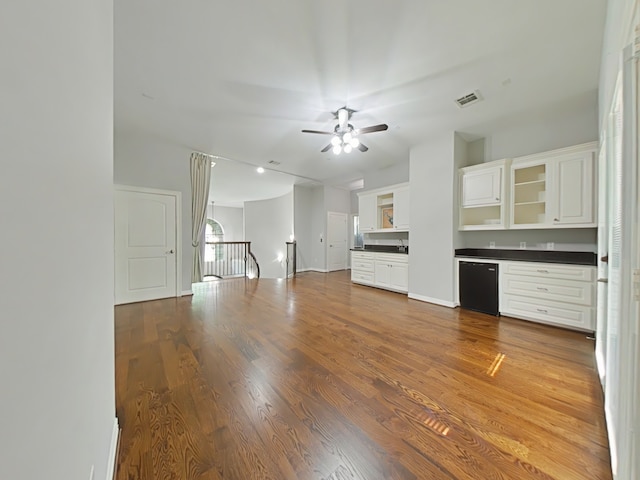 270 Lake Grove Dr, Coldspring, TX 77331 - unfurnished living room with wood finished floors, ceiling fan, baseboards, recessed lighting, and a sink