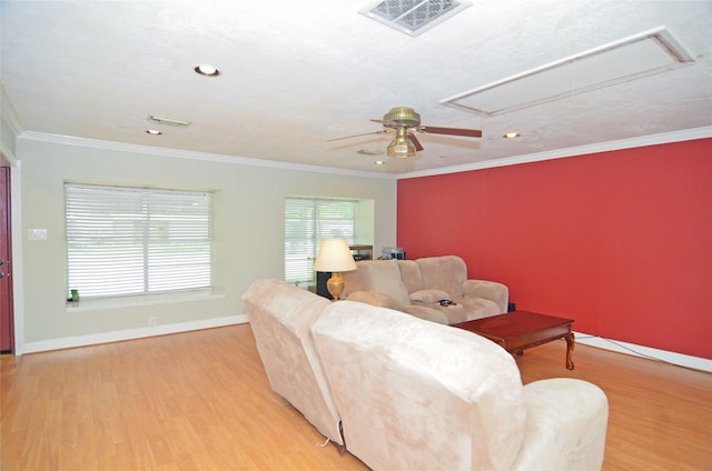 2719 Sweetgum St, Pasadena, TX 77502 - living area with attic access, wood finished floors, a ceiling fan, baseboards, and crown molding