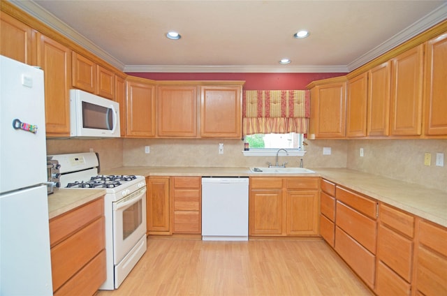 2719 Sweetgum St, Pasadena, TX 77502 - kitchen featuring white appliances, a sink, light wood finished floors, light countertops, and ornamental molding