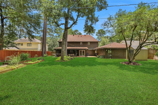 6522 Coral Ridge Rd, Houston, TX 77069 - rear view of house featuring a vegetable garden, a yard, fence, and a patio
