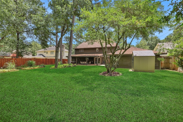 6522 Coral Ridge Rd, Houston, TX 77069 - view of yard featuring an outbuilding, a fenced backyard, and a storage shed