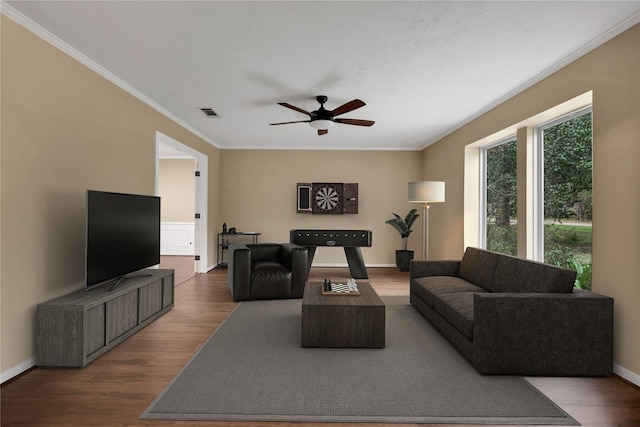 6522 Coral Ridge Rd, Houston, TX 77069 - living area featuring a ceiling fan, wood finished floors, baseboards, visible vents, and ornamental molding