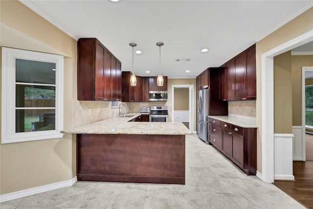 6522 Coral Ridge Rd, Houston, TX 77069 - kitchen featuring baseboards, ornamental molding, stainless steel appliances, a sink, and light stone counters