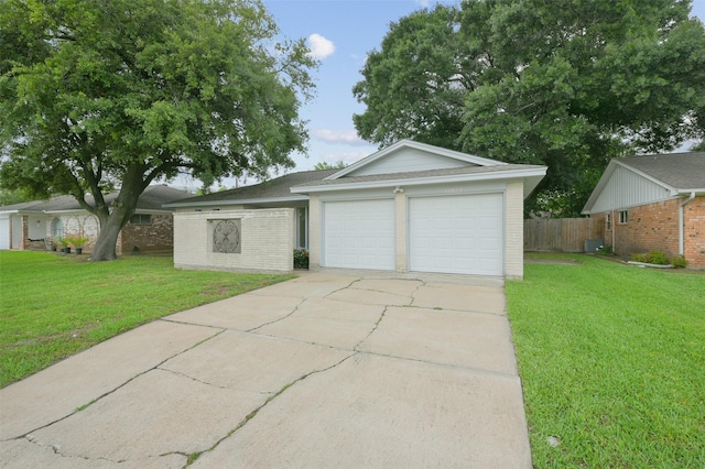 ranch-style house with driveway, an attached garage, fence, a front yard, and brick siding