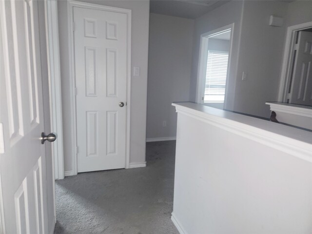 2395 Monroe St, Beaumont, TX 77703 - hallway featuring concrete floors and baseboards