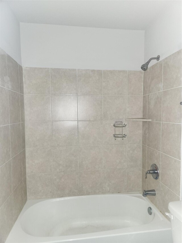 2395 Monroe St, Beaumont, TX 77703 - bathroom with tub / shower combination and toilet