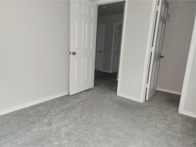 2395 Monroe St, Beaumont, TX 77703 - unfurnished bedroom with baseboards and carpet
