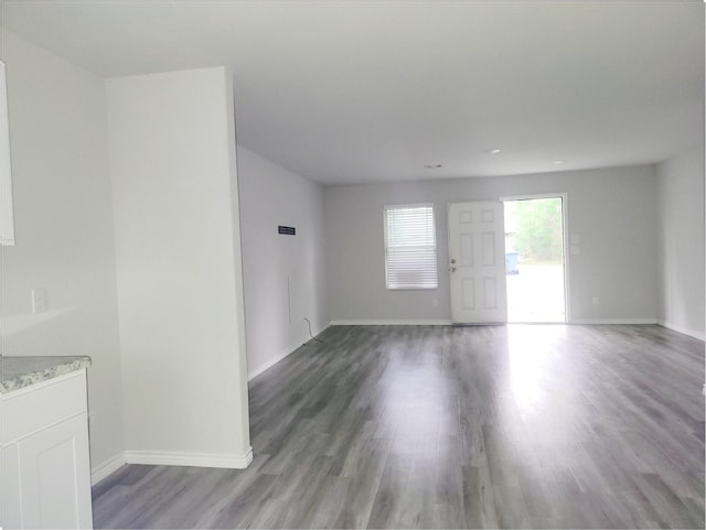 2395 Monroe St, Beaumont, TX 77703 - interior space with baseboards and wood finished floors
