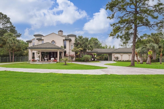 1204 Cowards Creek Dr, Friendswood, TX 77546 - exterior space featuring stucco siding, a front lawn, a tiled roof, and curved driveway