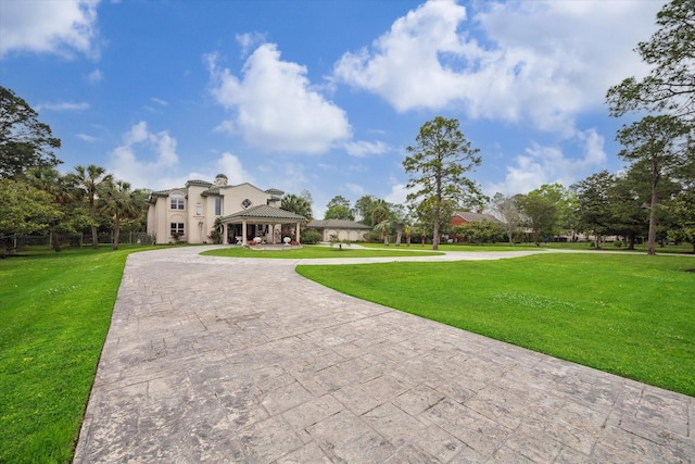1204 Cowards Creek Dr, Friendswood, TX 77546 - view of home's community with a gazebo, curved driveway, and a yard