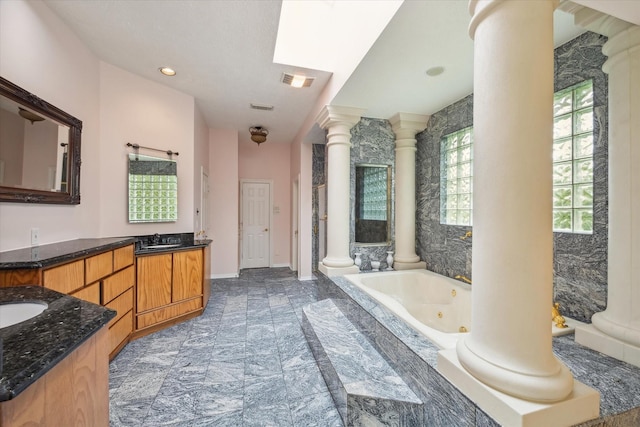 1204 Cowards Creek Dr, Friendswood, TX 77546 - full bath with a tub with jets, decorative columns, visible vents, and vanity