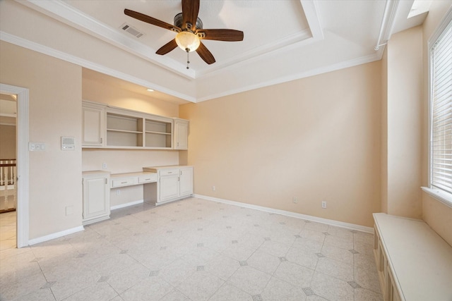 1204 Cowards Creek Dr, Friendswood, TX 77546 - unfurnished room featuring a ceiling fan, a raised ceiling, built in study area, and baseboards