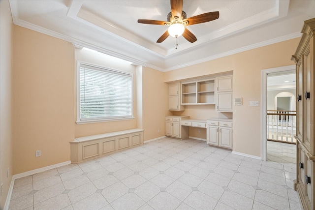 1204 Cowards Creek Dr, Friendswood, TX 77546 - interior space featuring baseboards, built in desk, a ceiling fan, and a raised ceiling