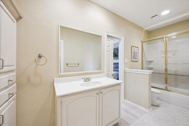 1204 Cowards Creek Dr, Friendswood, TX 77546 - full bath featuring tile patterned flooring, vanity, toilet, bath / shower combo with glass door, and visible vents