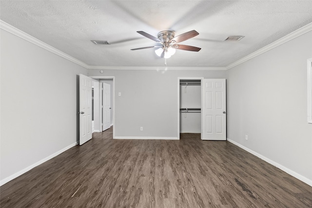 12109 22nd St, Santa Fe, TX 77510 - unfurnished bedroom featuring dark wood-type flooring, crown molding, a textured ceiling, a closet, and a ceiling fan