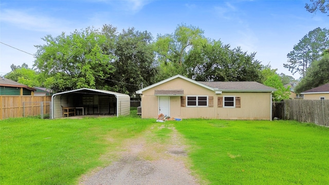 12109 22nd St, Santa Fe, TX 77510 - view of front of home with dirt driveway, a detached carport, and an outbuilding