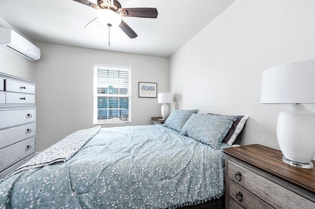 bedroom with an AC wall unit and a ceiling fan