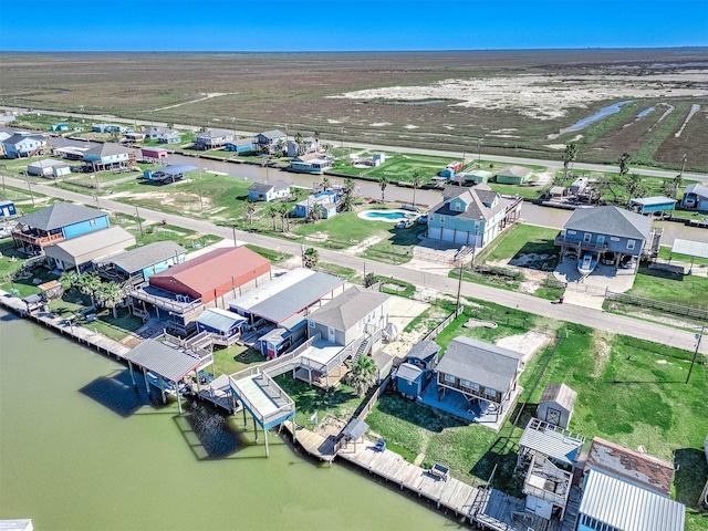 bird's eye view featuring a residential view and a water view