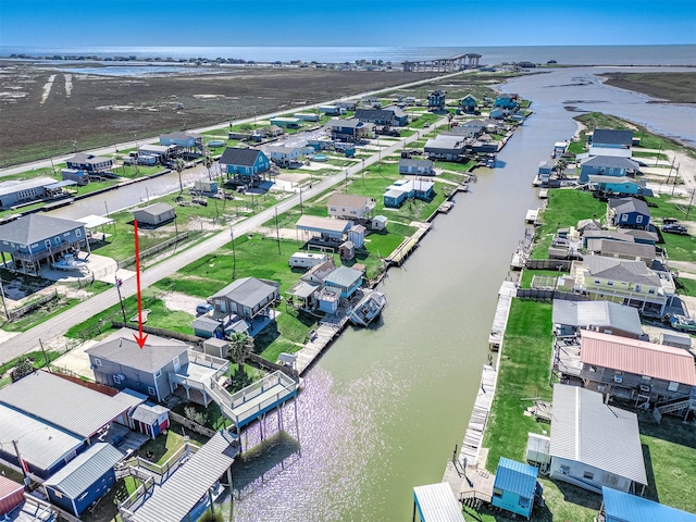 birds eye view of property featuring a residential view and a water view