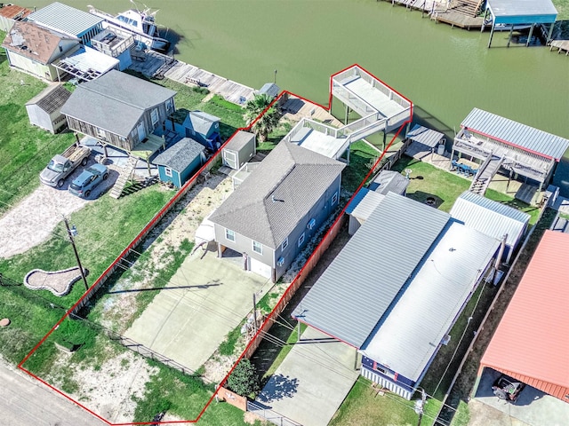bird's eye view with a residential view and a water view