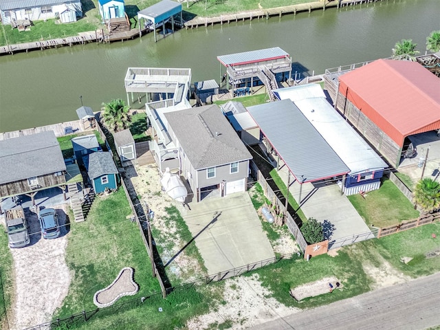 bird's eye view featuring a residential view and a water view